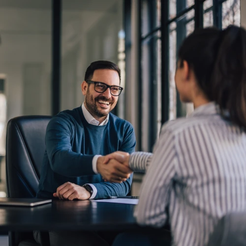 happy-businessman-shaking-hands-with-the-newly-em-2026-03-27-00-36-19-utc