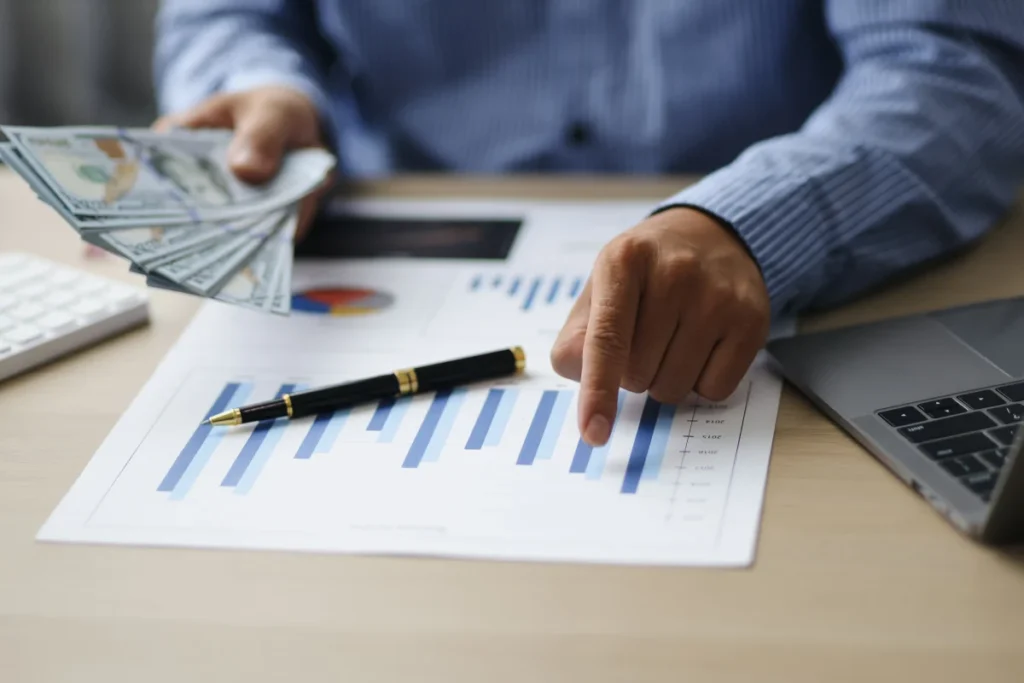 Close-up of financial analysis documents and business charts used for cash flow reporting and financial planning.