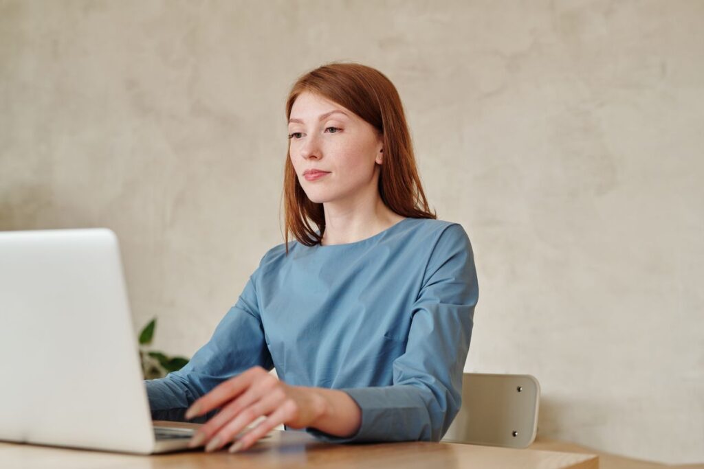 Business consultant analyzing financial charts and reports on a laptop for strategic business planning