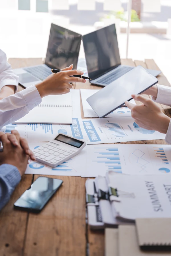 Business professionals reviewing financial documents and accounting reports