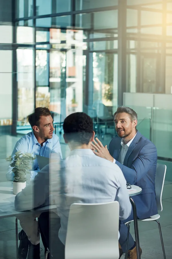 Business professionals in a meeting discussing financial strategy and growth