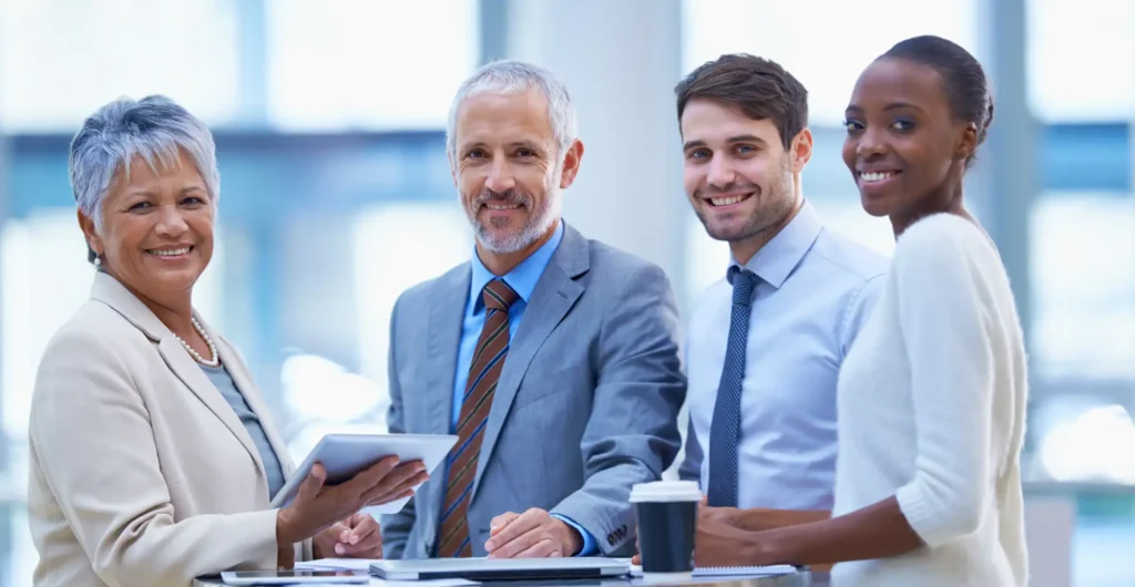 Business team reviewing financial reports with a controller helping interpret company data for decision making