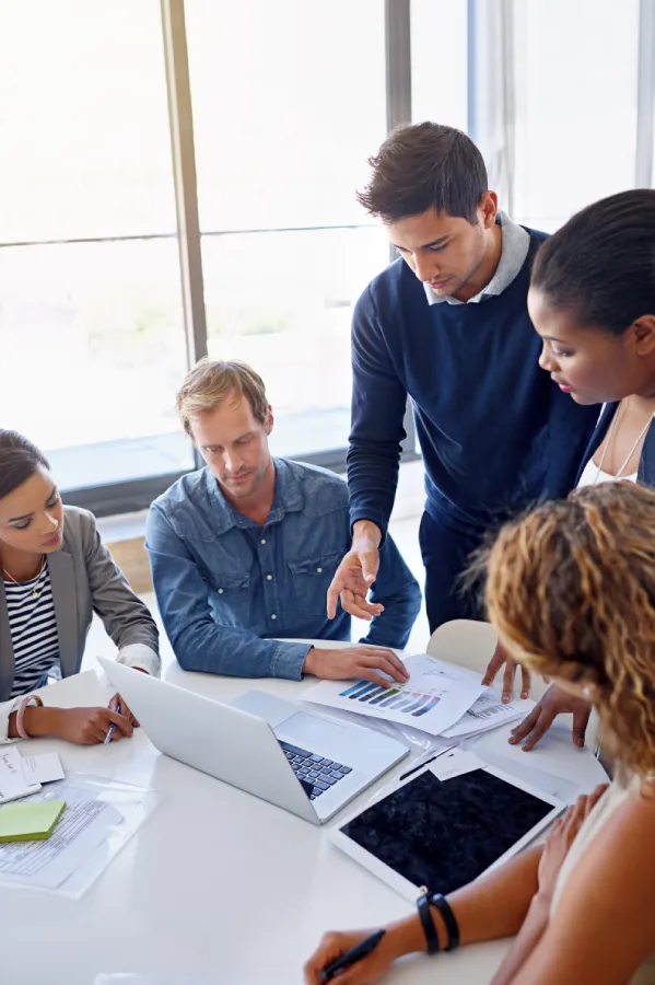 Business professionals in a meeting discussing financial strategy and growth