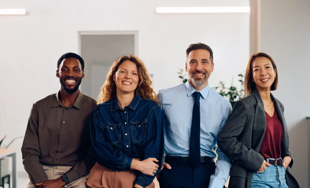 Professional business finance team standing together in a modern office environment